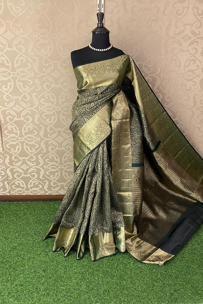 Forest green Kanjeevaram silk saree by Saarang Sarees with unstiched blouse, showcasing intricate traditional design and rich silk fabric.