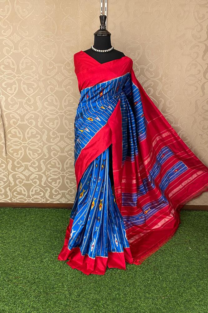 Blue Pochampally Ikat silk saree with intricate patterns and matching unstiched blouse, traditional Indian wear by Saarang Sarees.