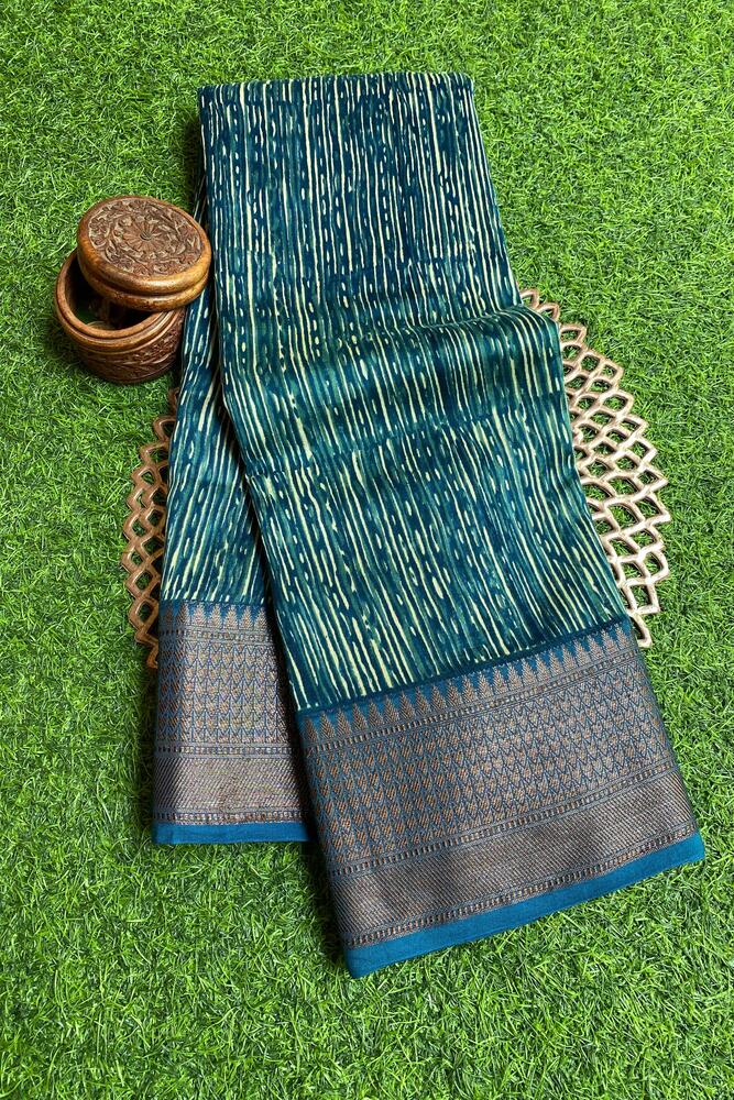 Traditional blue cotton Chanderi saree with intricate design, paired with an unstiched blouse for elegant ethnic wear.