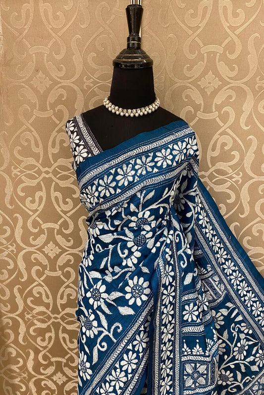 Deep teal blue tussar embroidery saree with kantha work border and matching unstitched blouse, traditional wear by Saarang Sarees.