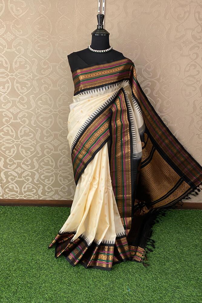 Elegant Off-White Gadwal Silk Saree with intricate border and matching unstitched blouse, traditional Indian wear by Saarang Sarees.