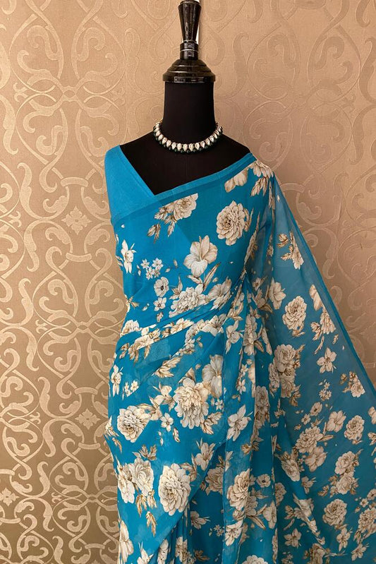 Royal blue floral printed chiffon saree with unstiched blouse piece, perfect for party wear from Saarang Sarees.