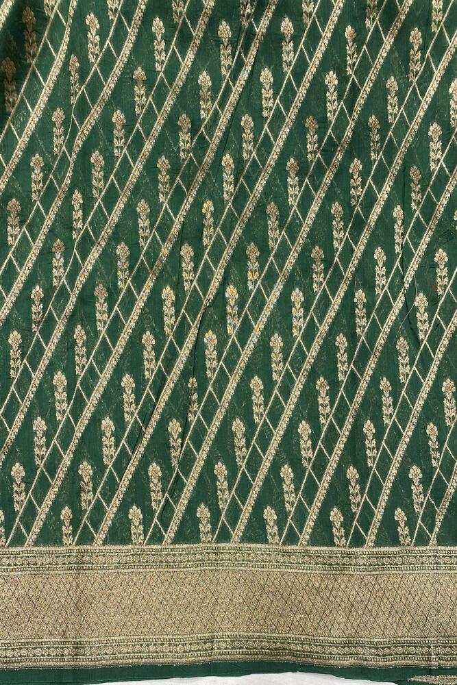 Beige brocade Chanderi silk saree with intricate designs, paired with an unstiched blouse for traditional wear.