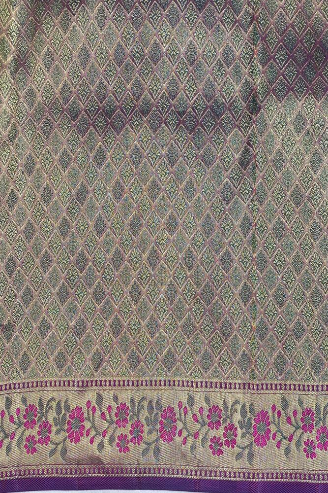 Deep purple pure Kanjeevaram silk saree with traditional design and unstiched blouse from Saarang Sarees, perfect for special occasions.