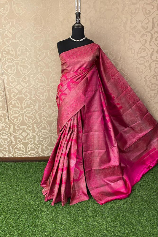 Rani Pure Kanjeevaram silk saree with intricate gold zari work and bright traditional colors, paired with an unstiched blouse.