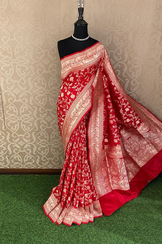 Red Uppada Banarasi saree with intricate gold zari patterns and matching unstiched blouse, traditional Indian wear by Saarang Sarees.