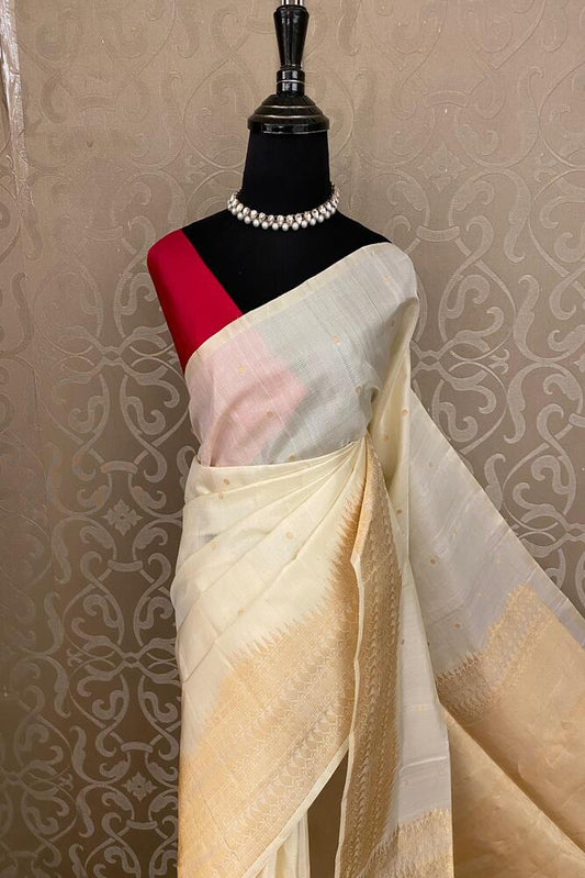Off-White Coimbatore silk saree from Saarang Sarees with traditional design and an unstiched blouse for elegant cultural wear.