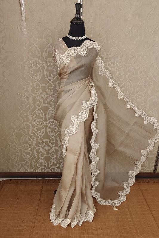 Light brown organza silk saree with resham embroidery and unstiched blouse, perfect for party wear by Saarang Sarees.