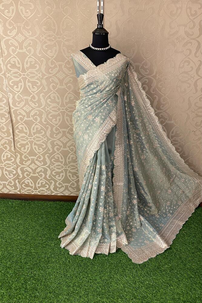 Light blue tissue organza silk saree with embroidery, party wear design from Saarang Sarees, featuring an unstiched blouse.