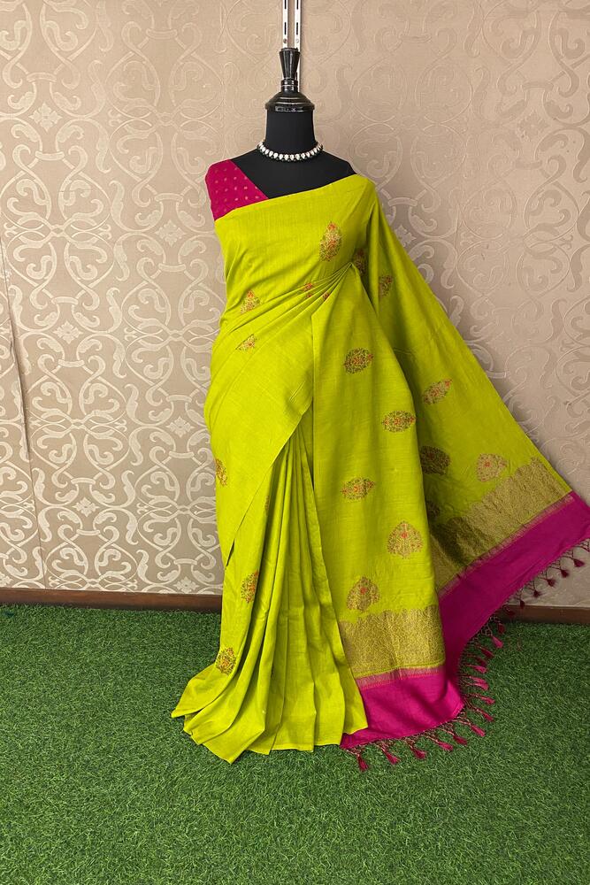 Lime green Munga Banarasi silk saree with intricate gold zari work and matching unstiched blouse, traditional wear from Saarang Sarees.