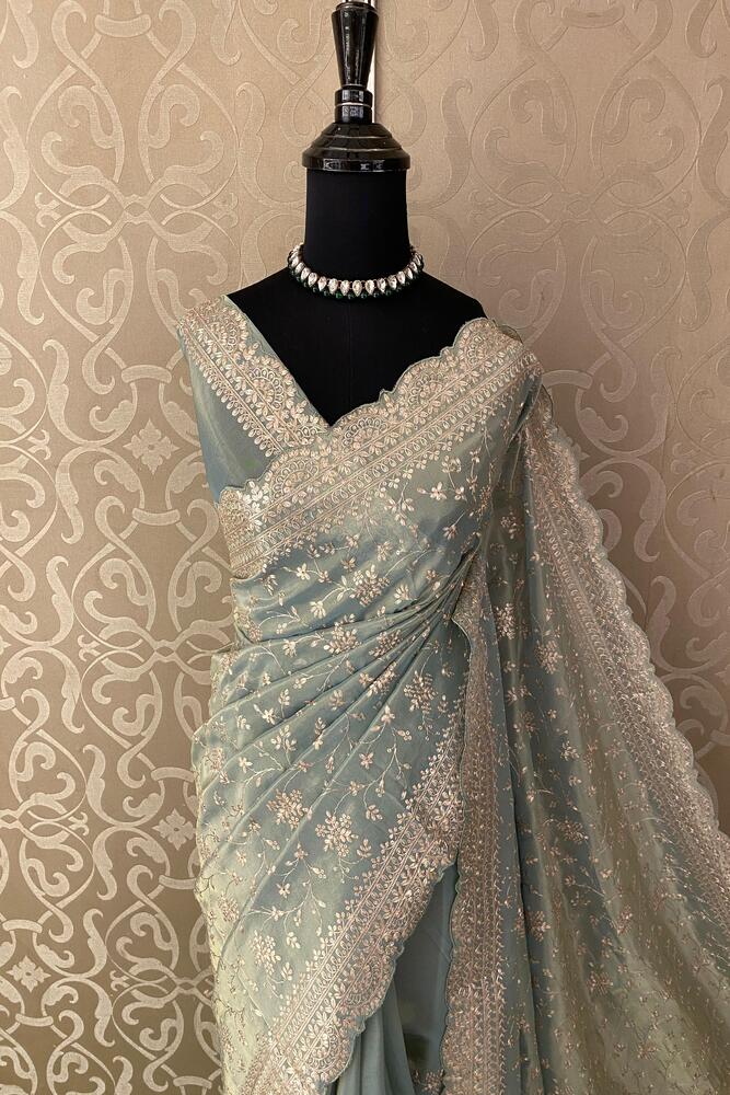 Light blue tissue organza silk saree with embroidery and unstiched blouse, perfect for party wear by Saarang Sarees.