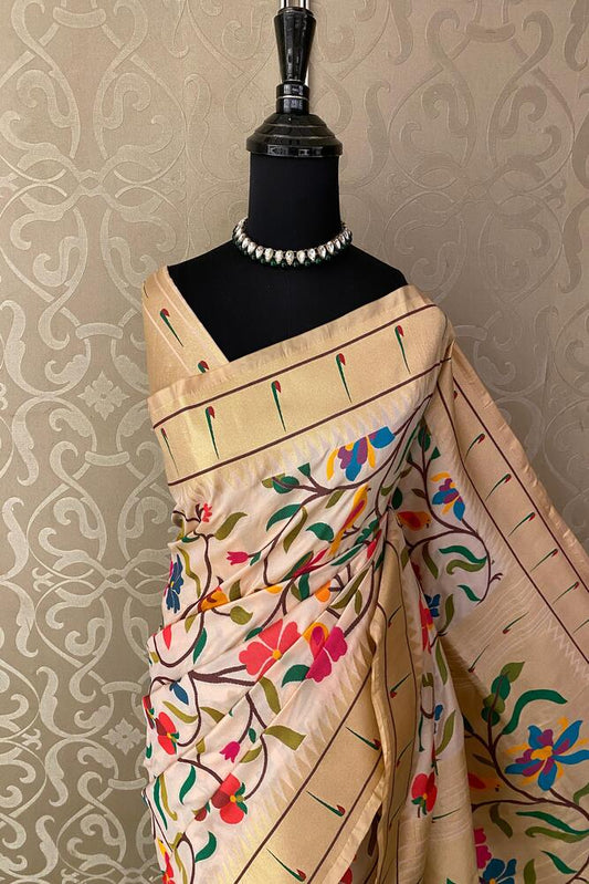Off-White Paithani silk saree with intricate traditional patterns and unstiched blouse, crafted by Saarang Sarees for elegant wear