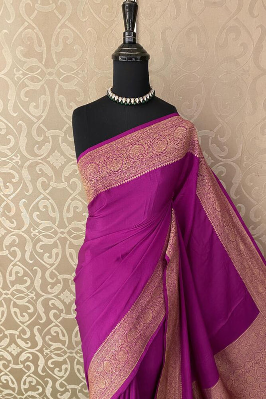 Magenta Mysore Crepe Silk Banarasi saree with intricate gold zari work and matching unstiched blouse for traditional wear.