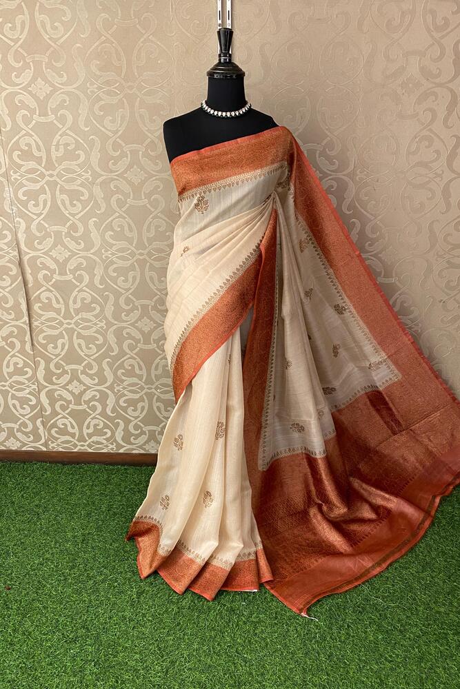 Off-White Tussar Banarasi silk saree by Saarang Sarees with handwoven motifs and an unstiched blouse for traditional wear.