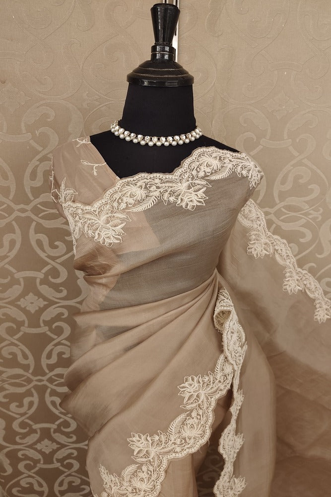 Light brown organza silk saree with resham embroidery and unstiched blouse, ideal for party wear by Saarang Sarees.