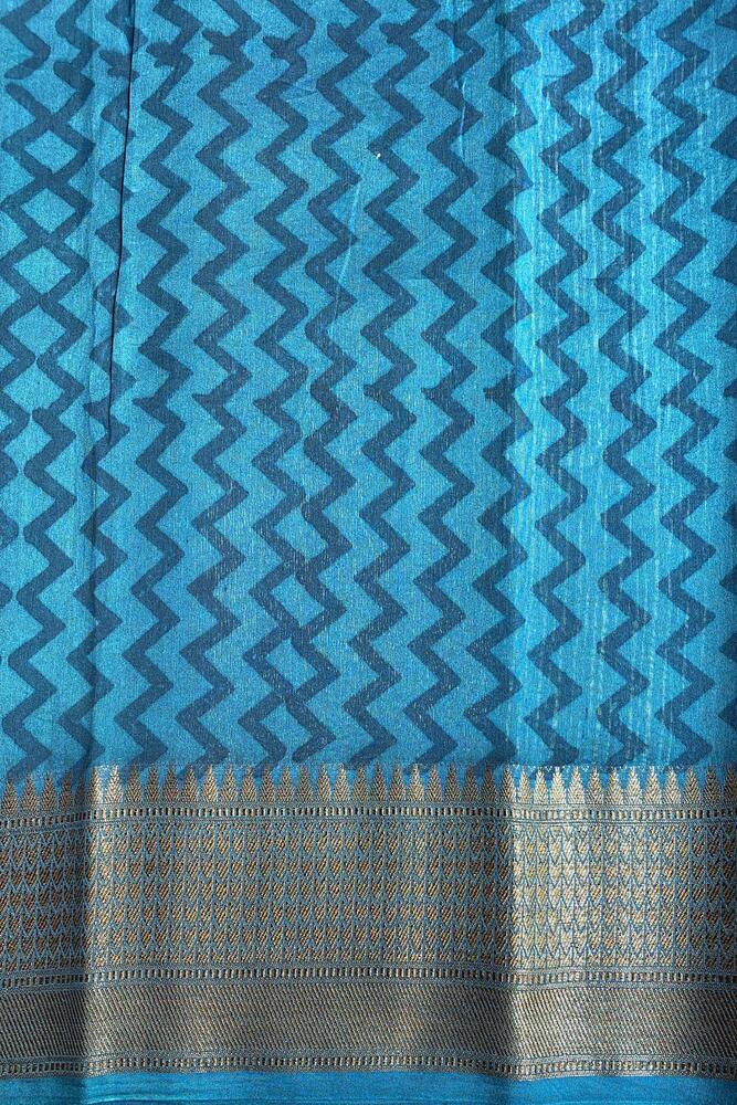 Blue cotton Chanderi saree with intricate traditional patterns from Saarang Sarees, paired with an unstitched blouse for elegant wear.