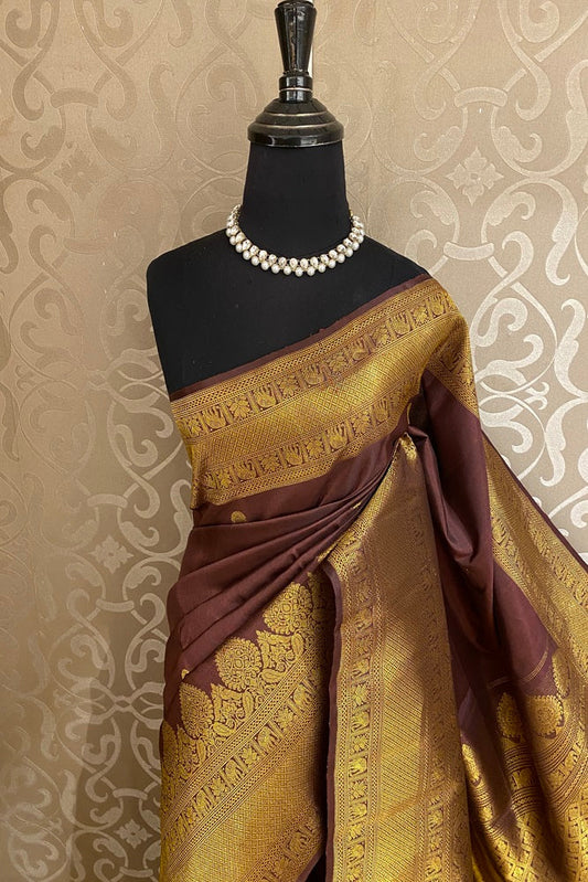 Chocolate brown Kanjeevaram silk saree with handwoven design and matching unstitch blouse, traditional wear by Saarang Sarees