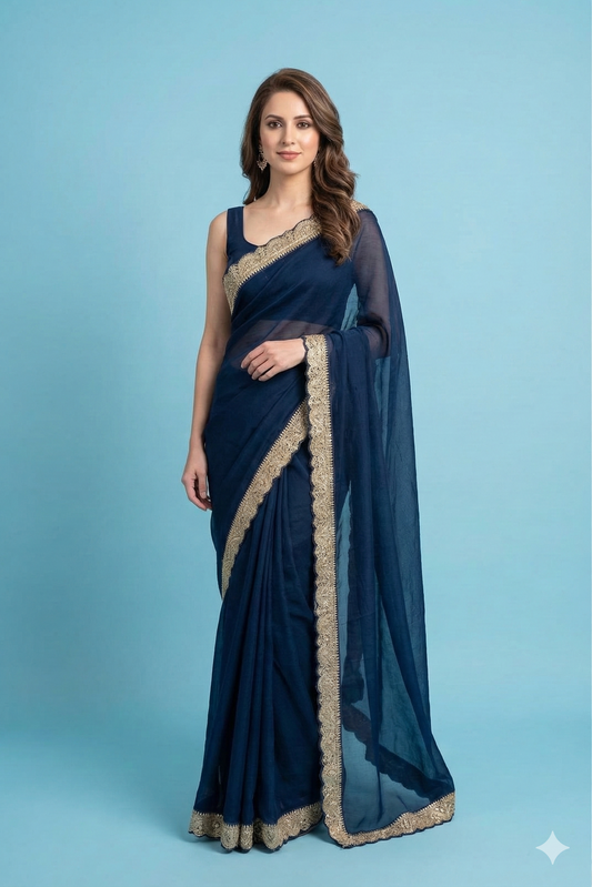 Navy blue organza silk saree with zari border, party wear by Saarang Sarees, showcasing elegant drape and intricate border details.